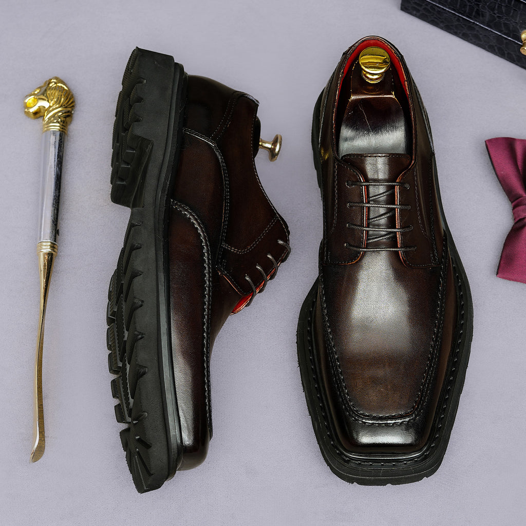 Men's chunky lug-sole wingtip brogue oxford shoes, dark color, side and front views.