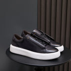 Men's black leather sneakers with lace-up closure and white sidewall sole