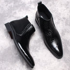 Men's black textured leather ankle boots with side zip and thick sole, alternate angle