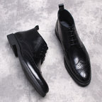 Black wingtip lace-up dress boots, side and front views