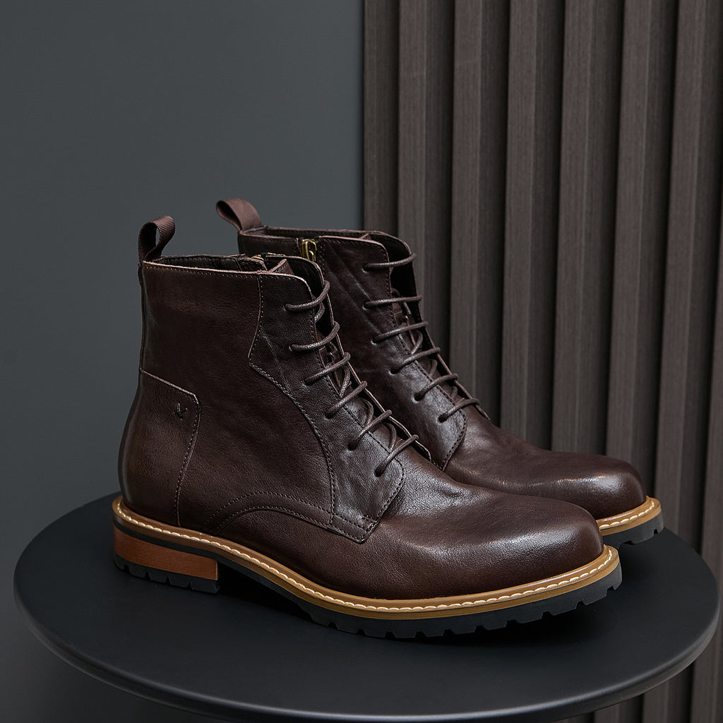 Men's dark brown leather lace-up ankle boots with pointed toe and side zip.