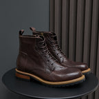 Men's dark brown leather lace-up ankle boots with pointed toe and side zip.
