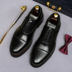 Black leather oxford shoes with lace-up front and chunky platform sole