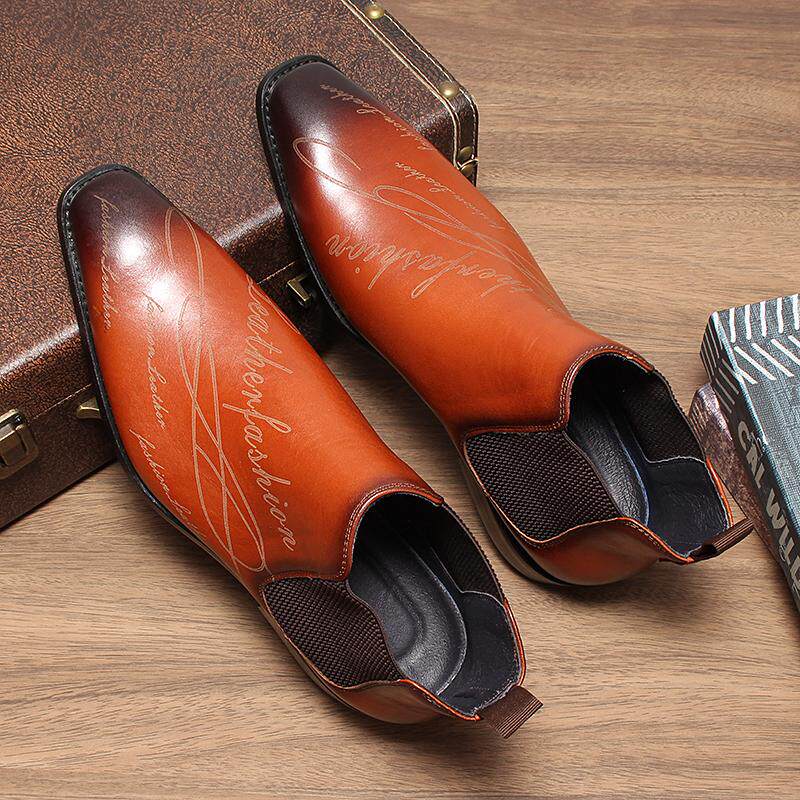 Brown leather Chelsea boots shown from above, with elastic side panels and dark soles