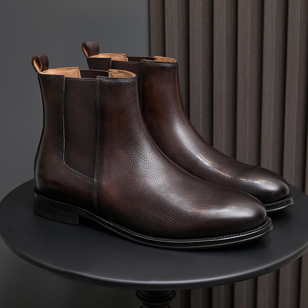Pair of men's chelsea dress boots, dark brown leather, pointed toe, elastic gore