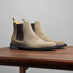 Taupe Chelsea dress boot side profile with elastic gore and low stacked heel.