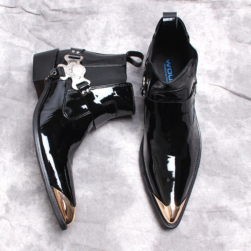 Black patent Chelsea dress boots, slip-on design with decorative silver buckle and straps.