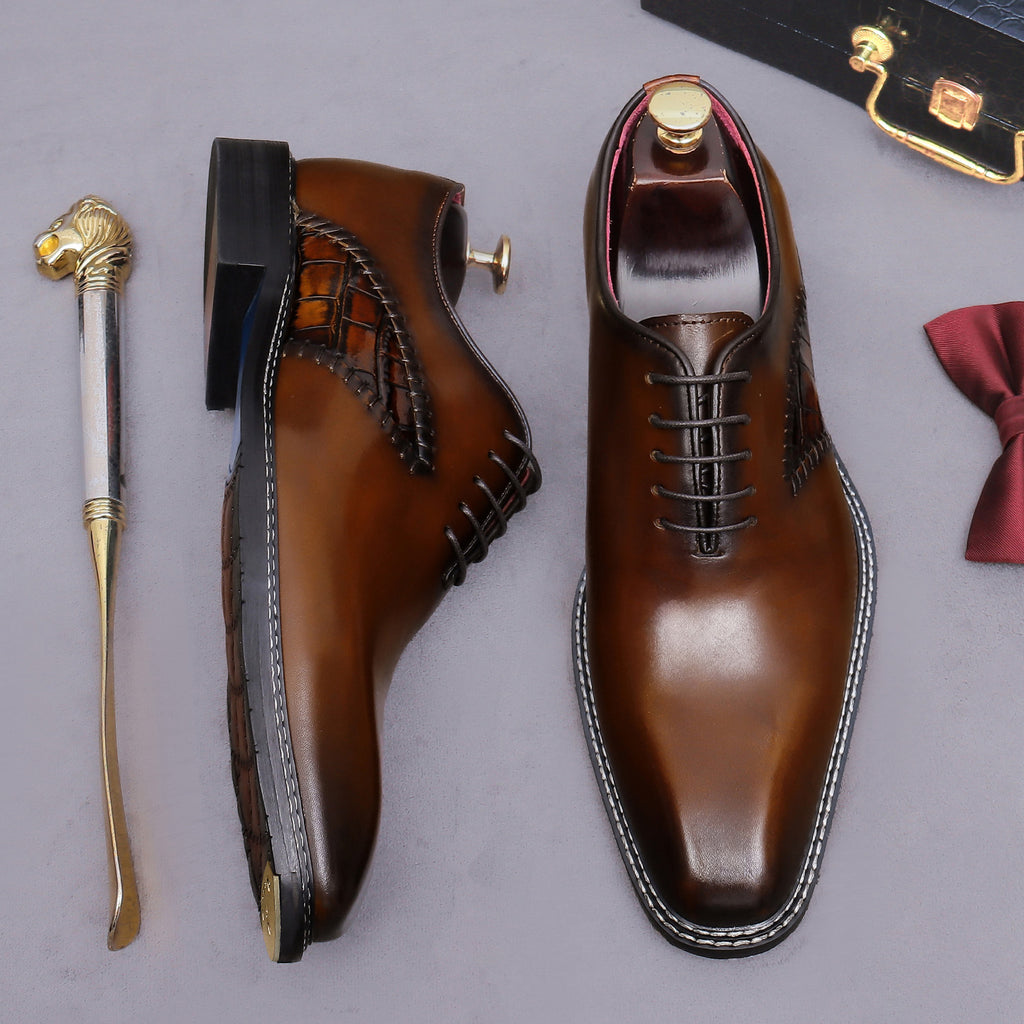 Brown lace-up wingtip brogue oxford shoes, side and front views with chunky sole