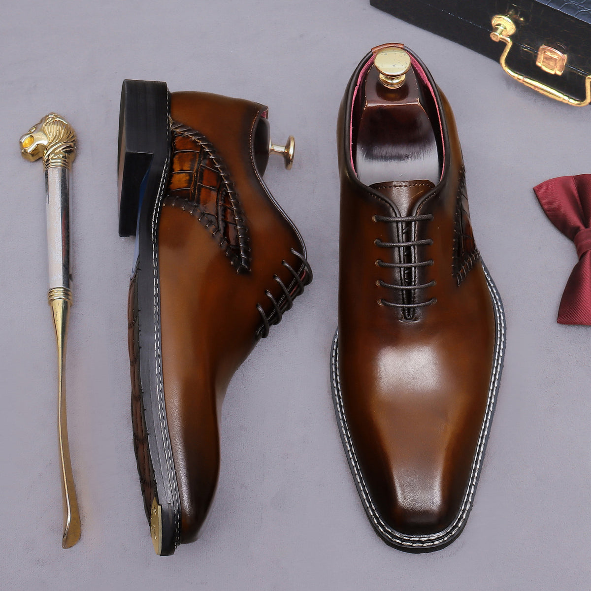 Brown lace-up wingtip brogue oxford shoes, side and front views with chunky sole