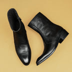 Men's black leather side-zip dress boots, angled pair with thick sole