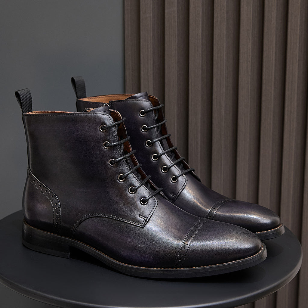 Men's dark leather lace-up ankle boots pair with stitched panels and low block heel