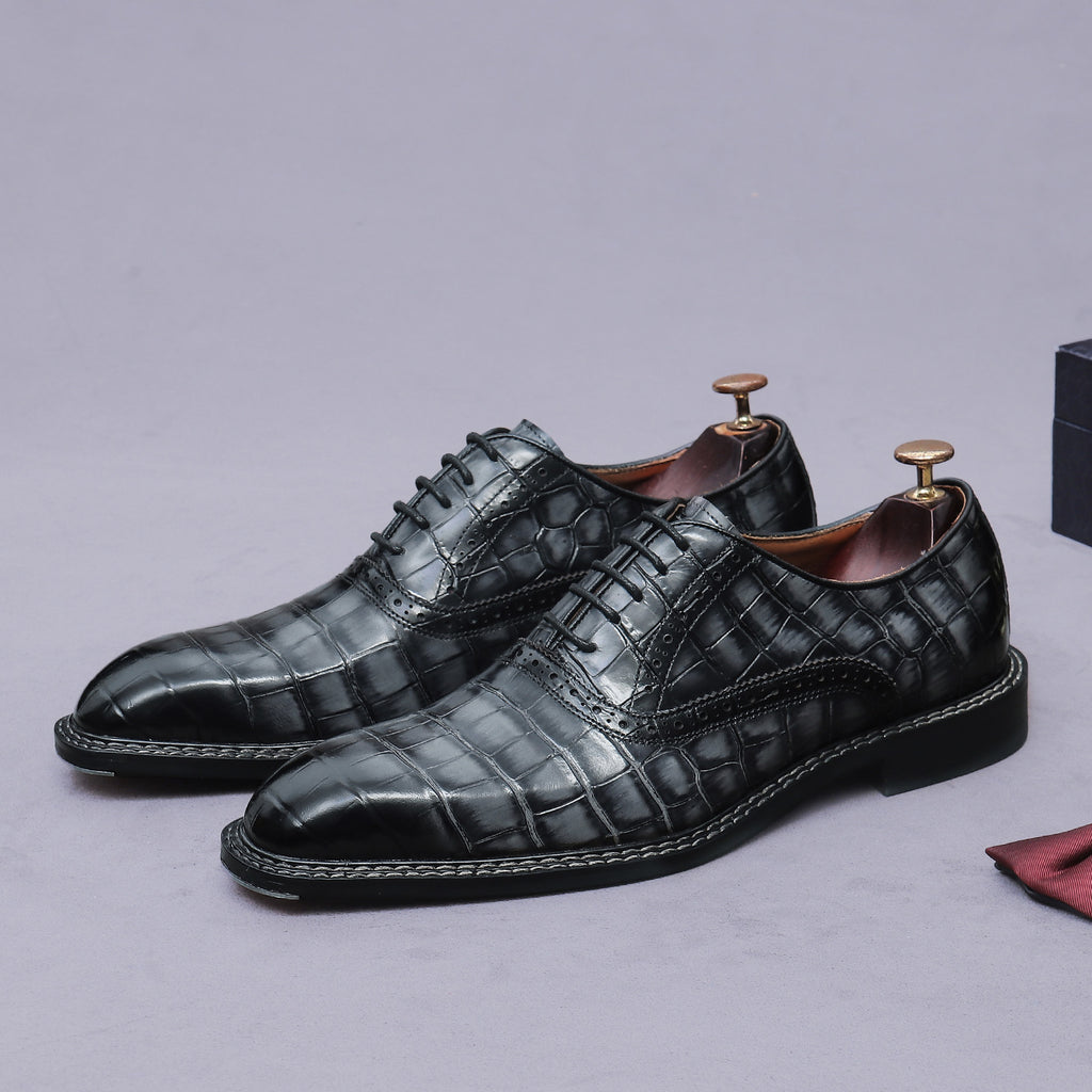 Men's black wingtip brogue oxford shoes with chunky lug sole and lace-up closure, side view