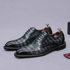 Men's black wingtip brogue oxford shoes with chunky lug sole and lace-up closure, side view