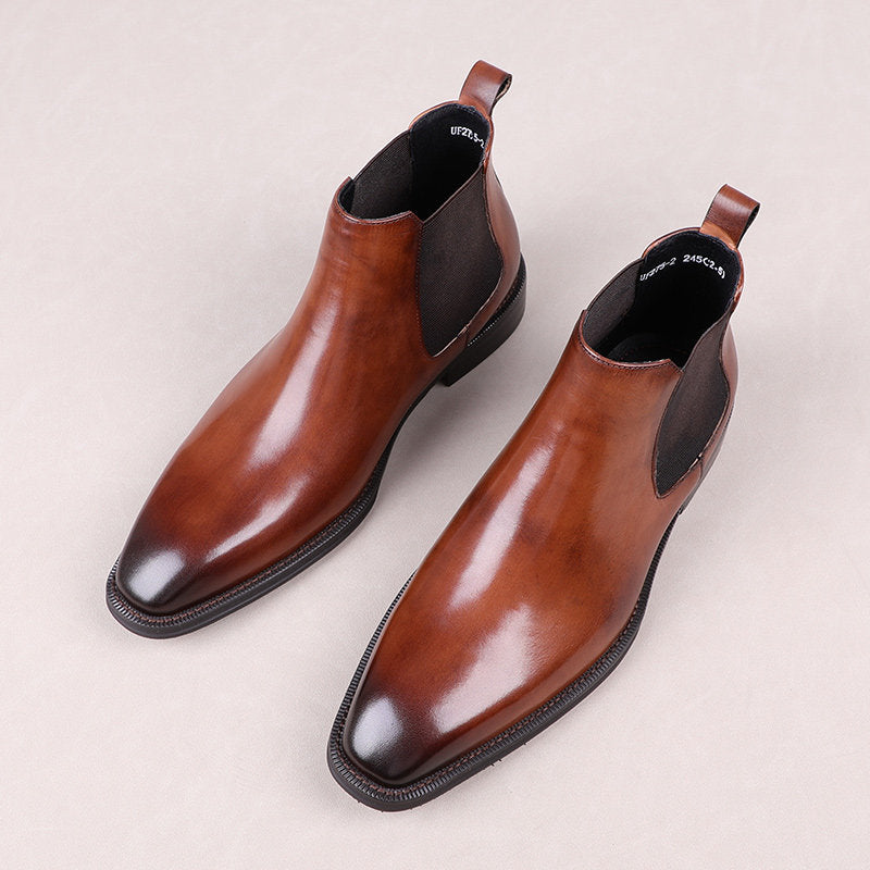Brown leather slip-on Chelsea dress boots with elastic side panels and dark sole