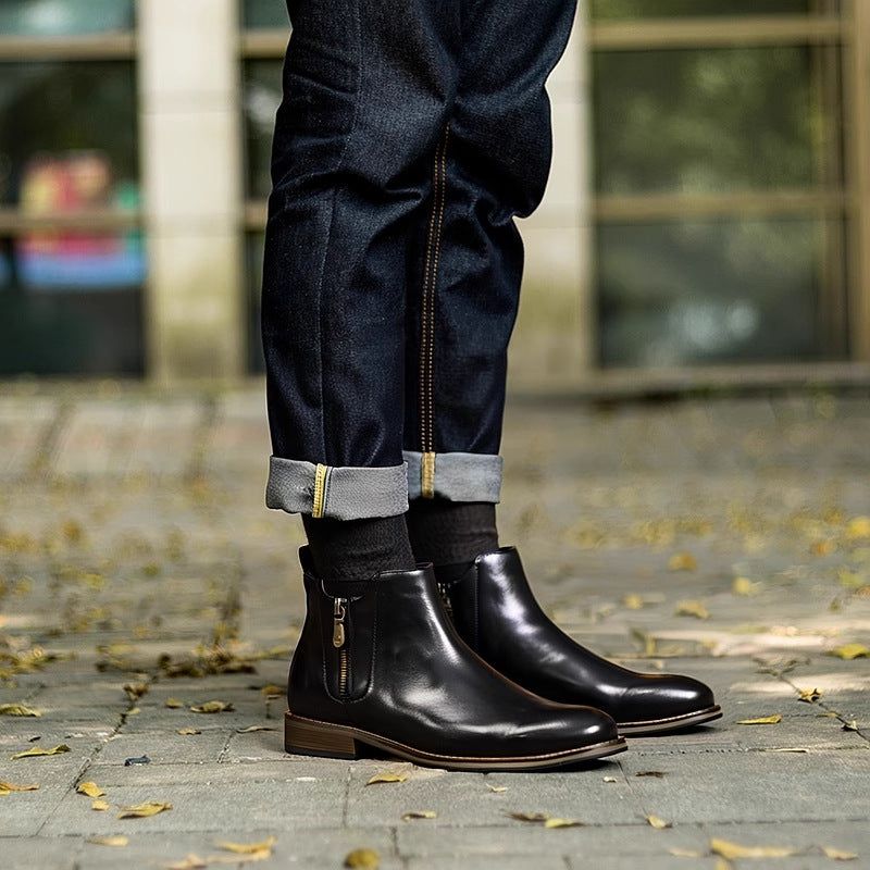 Black leather pointed-toe ankle boots with side zipper and low stacked heel