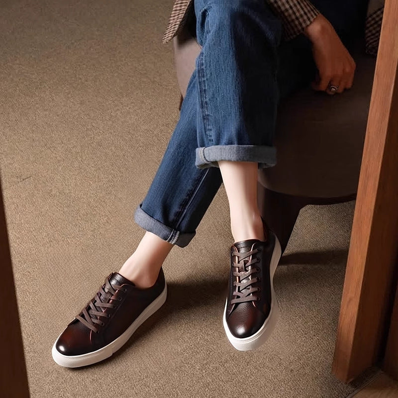 Men's black leather lace-up sneakers with white rubber sole