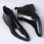 Men's black leather dress boots with thick sole and side zipper detail