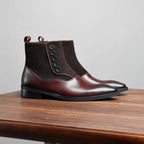 Dark brown leather ankle boots with side zip and thick sole, side profile view
