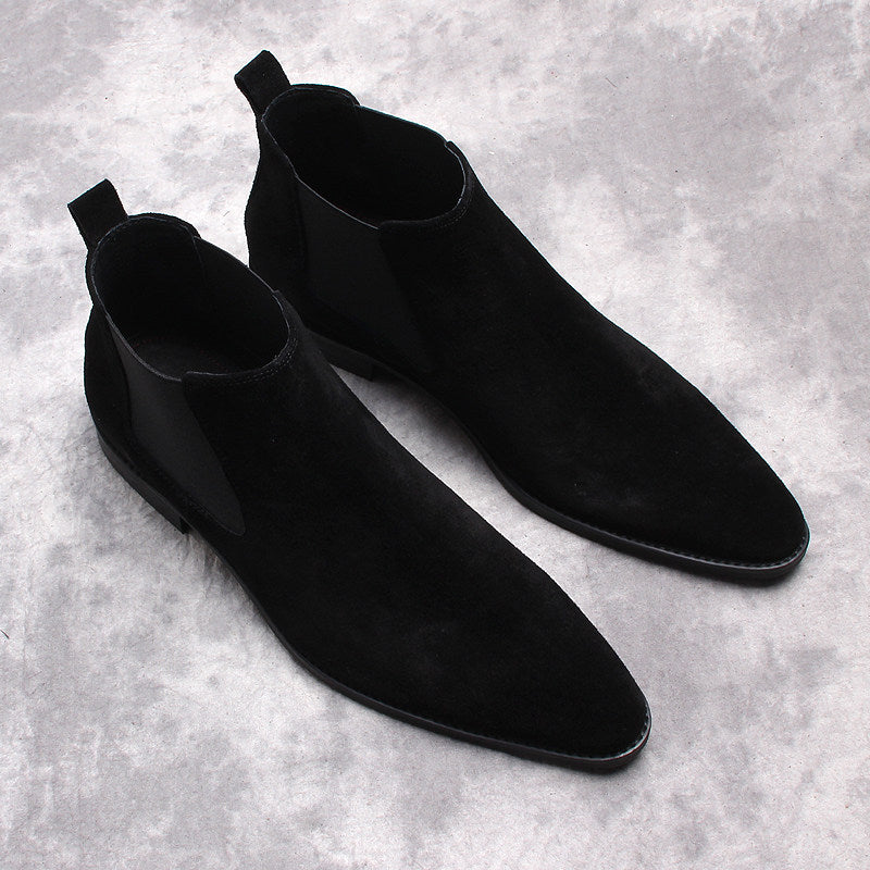 Pair of black suede Chelsea dress boots with elastic side gore and low stacked heels