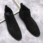 Men's black Chelsea dress boots pair, slip-on style with elastic sides