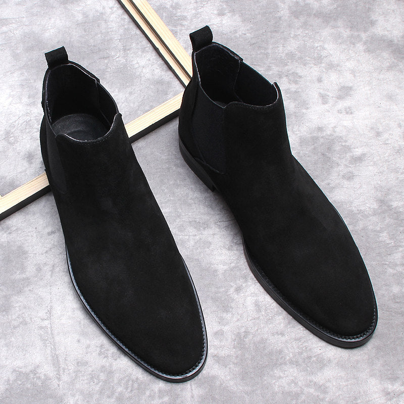 Men's black Chelsea dress boots pair, slip-on style with elastic sides