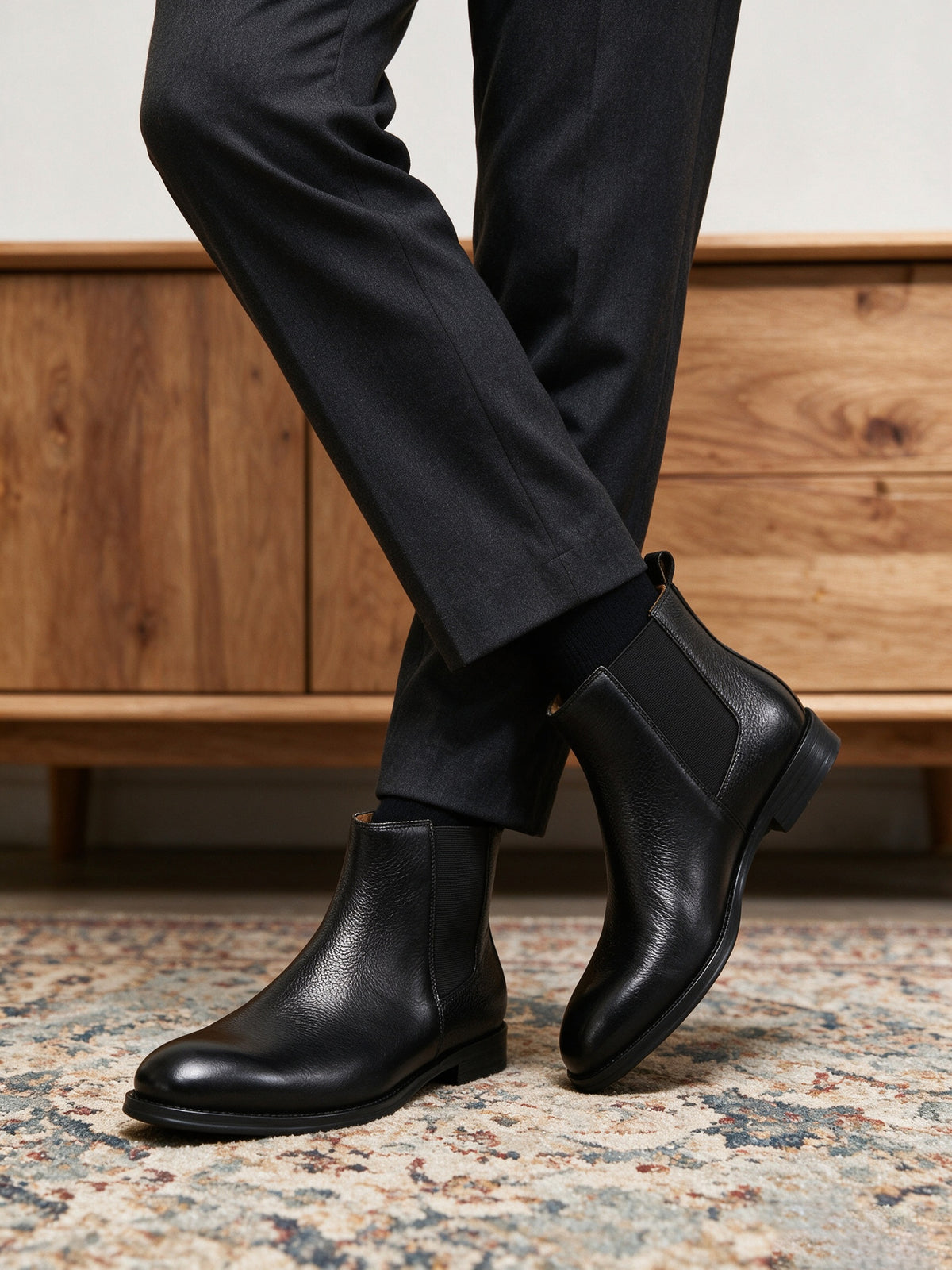 Black pointed-toe Chelsea boots with elastic side gore and low sole