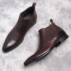 Dark brown leather Chelsea boots pair view with elastic side panels and pull tabs