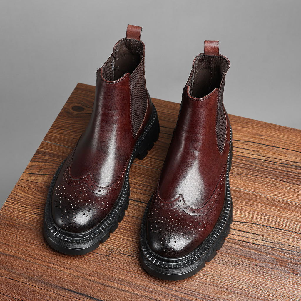 Brown leather chelsea dress boots with elastic side panels, brogue perforations, chunky sole