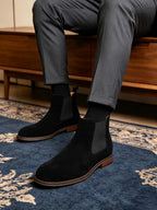 Black suede Chelsea ankle boots with elastic side gore and low stacked heel