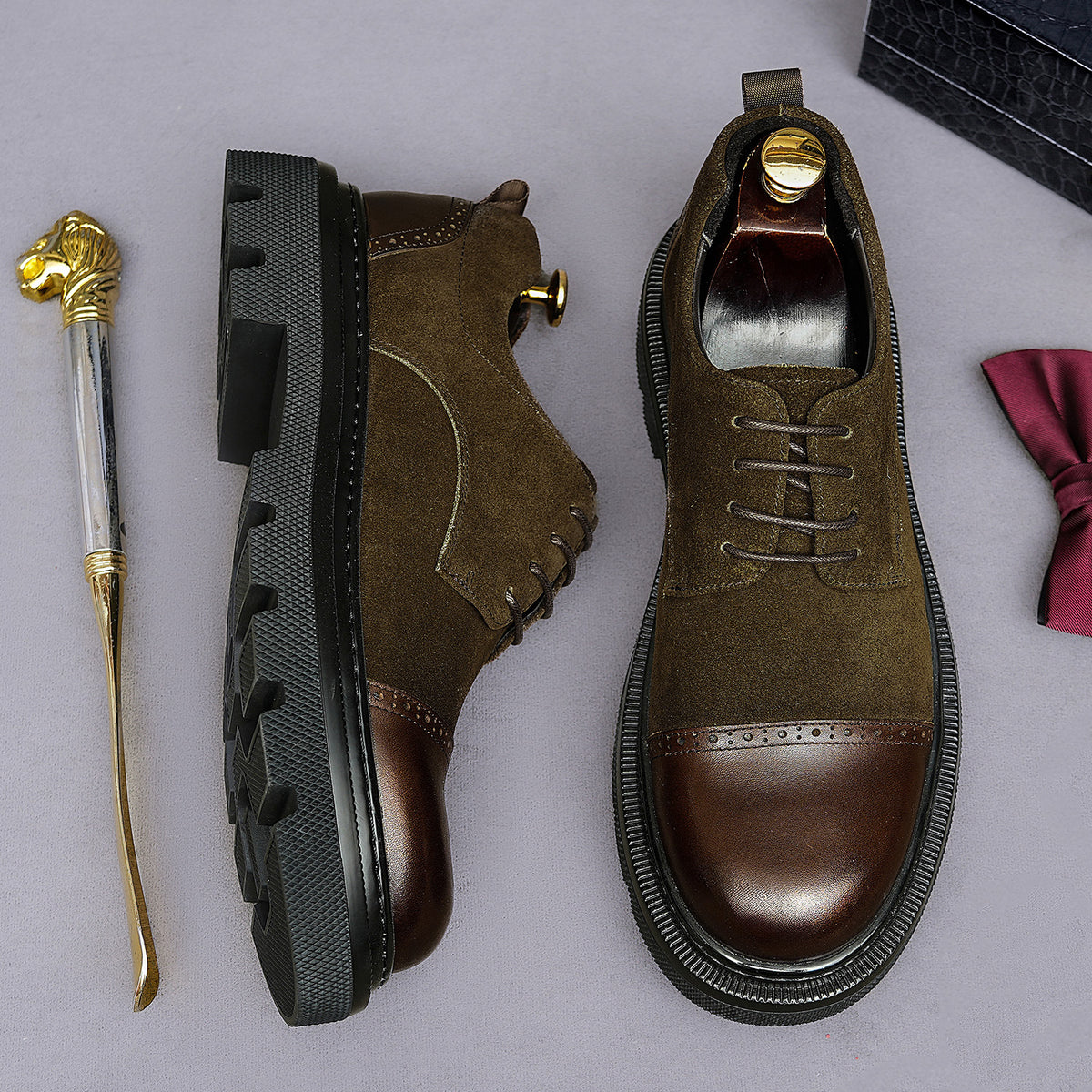 Dark brown suede oxfords with wingtip brogue trim and chunky lug side sole