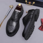 Men's chunky lug sole wingtip brogue oxfords, black pair, lace-up with rugged lug sole