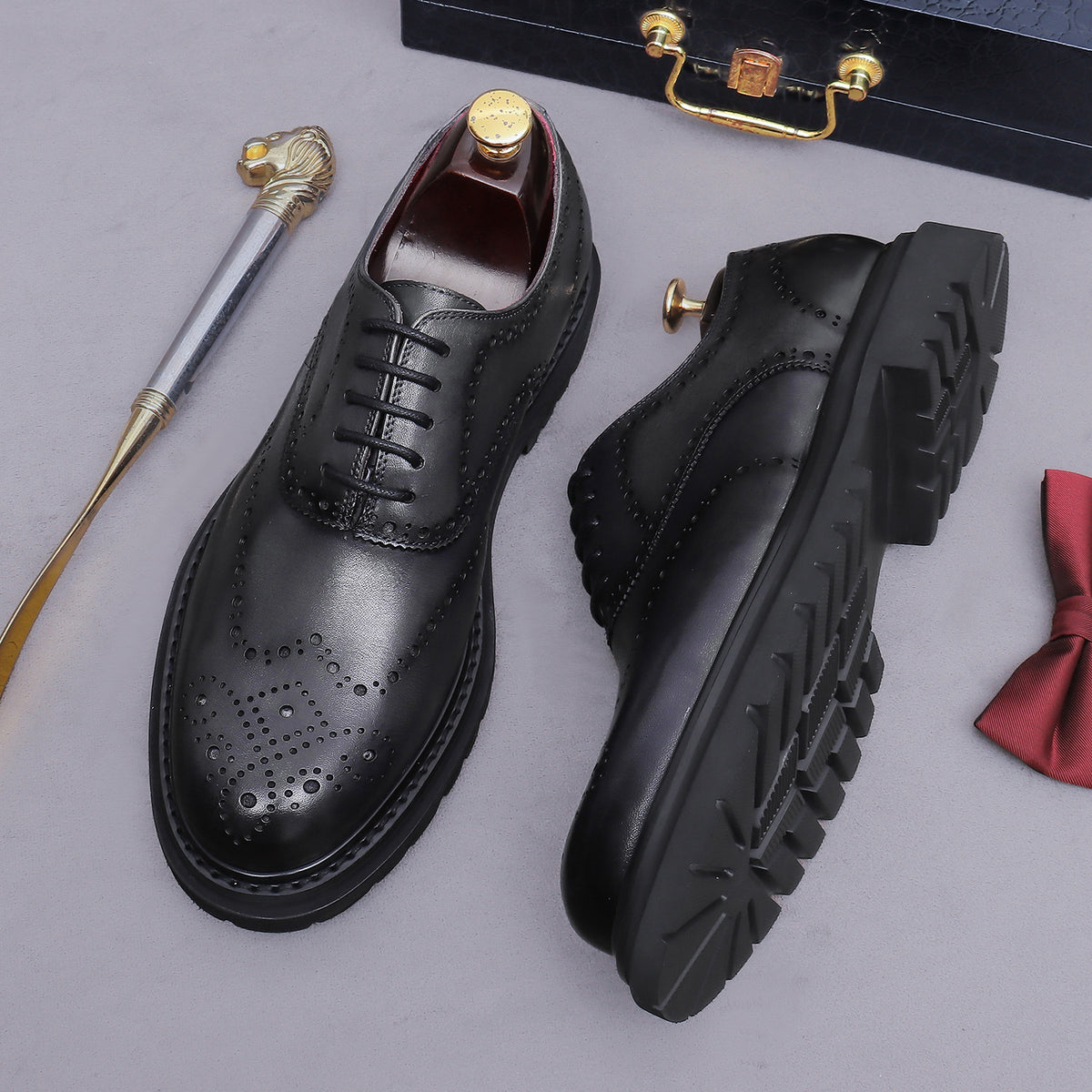 Men's chunky lug sole wingtip brogue oxfords, black pair, lace-up with rugged lug sole