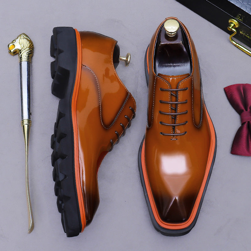 Men's brown wingtip brogue oxford shoes, side profile with chunky lug sole