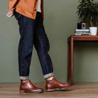 Men's pointed cap-toe leather side-zip dress boots, brown, worn with rolled cuffs