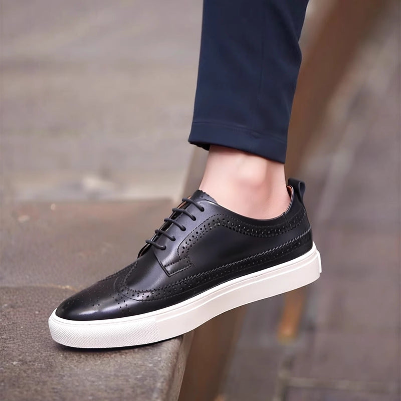 Men’s black leather lace-up sneakers with brogue perforations and white platform sole