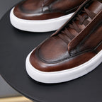 Brown leather sneakers with lace-up vamp and white rubber sole
