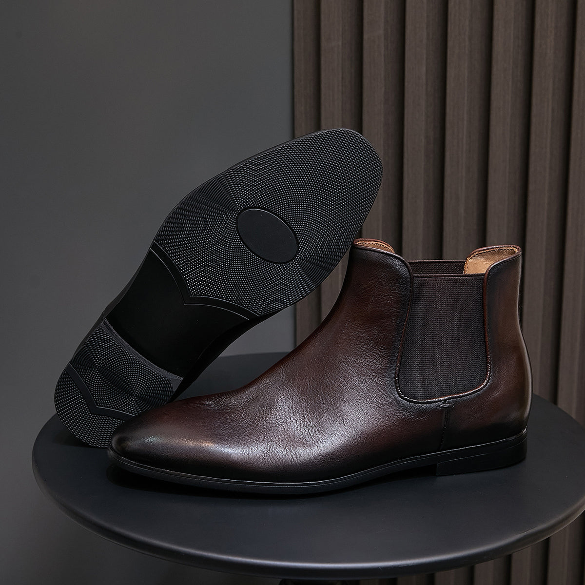 Dark brown suede Chelsea dress boots with pointed toe and textured rubber sole