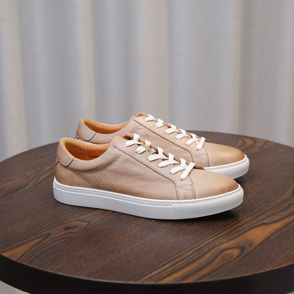Men's leather sneakers, beige/tan, side profile with white laces and sole