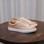 Men's leather sneakers, beige/tan, side profile with white laces and sole