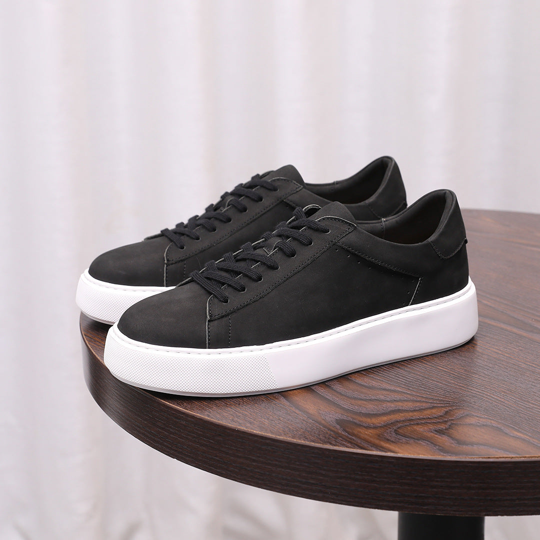 Black leather sneakers, lace-up with low-profile white rubber sole