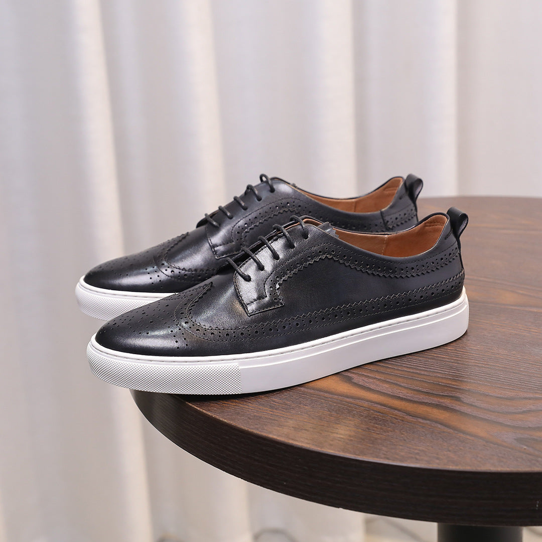 Men’s black leather sneakers with lace-up closure, perforated accents, and white sole