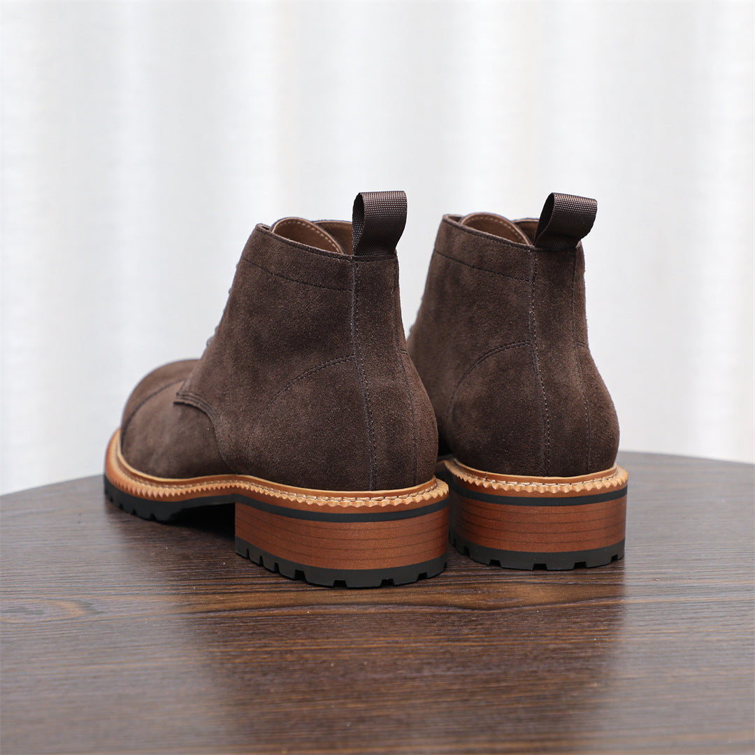 Men's dark brown suede chukka boots viewed from back, lace-up and chunky rubber sole