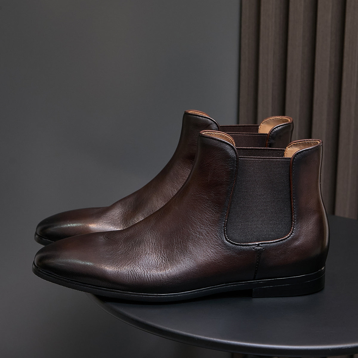 Dark brown suede Chelsea dress boots, side angle with elastic gore panels