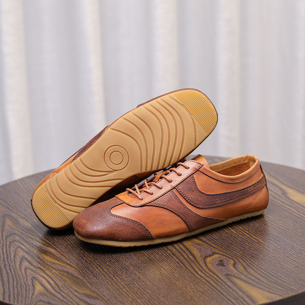 Brown leather lace-up sneakers with treaded rubber outsole, padded tongue