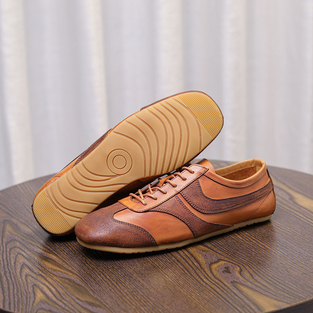 Brown leather lace-up sneakers with treaded rubber outsole, padded tongue