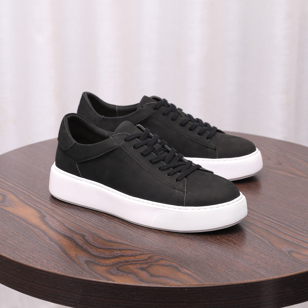 Black leather lace-up sneakers with clean side panels and white rubber sole