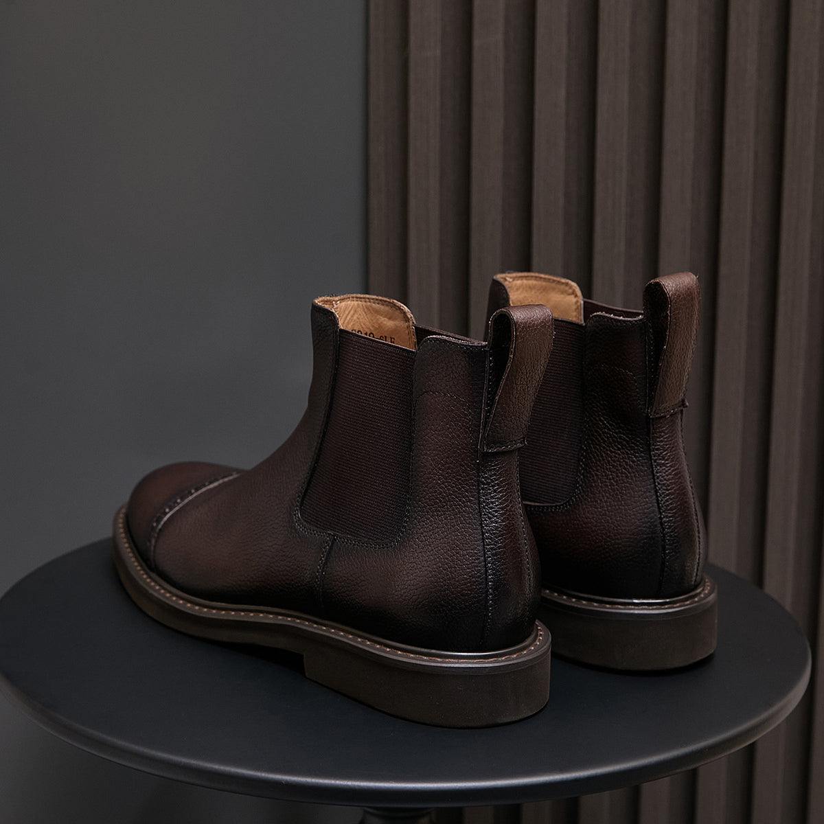 Dark brown suede chelsea dress boots with elastic side panels and pointed toe
