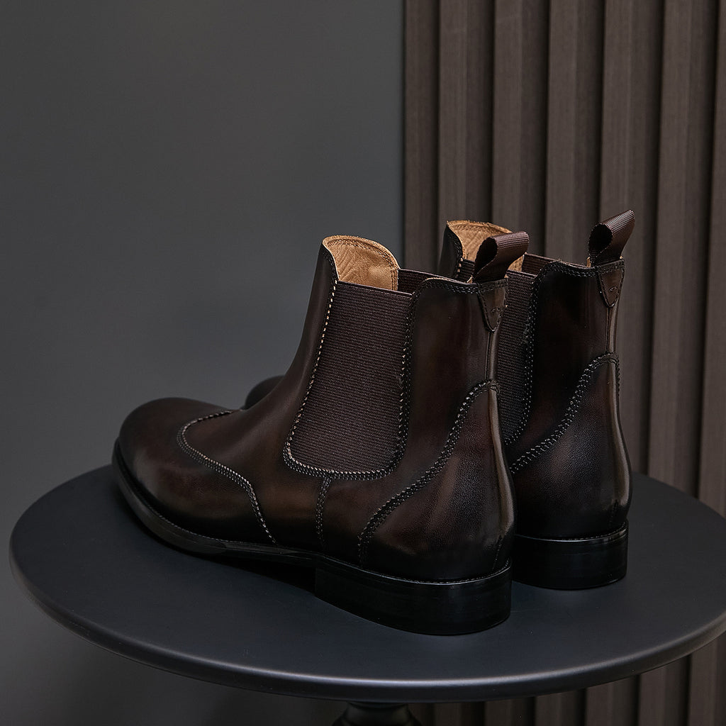 Pointed-toe chelsea dress boots pair with elastic panels, dark brown and black pair