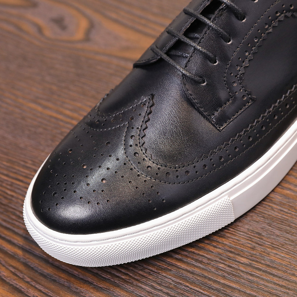 Men’s black leather lace-up sneaker with perforated toe and textured white platform sole
