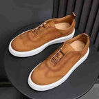 Men's genuine leather sneakers in brown with lace-up detail and white platform sole